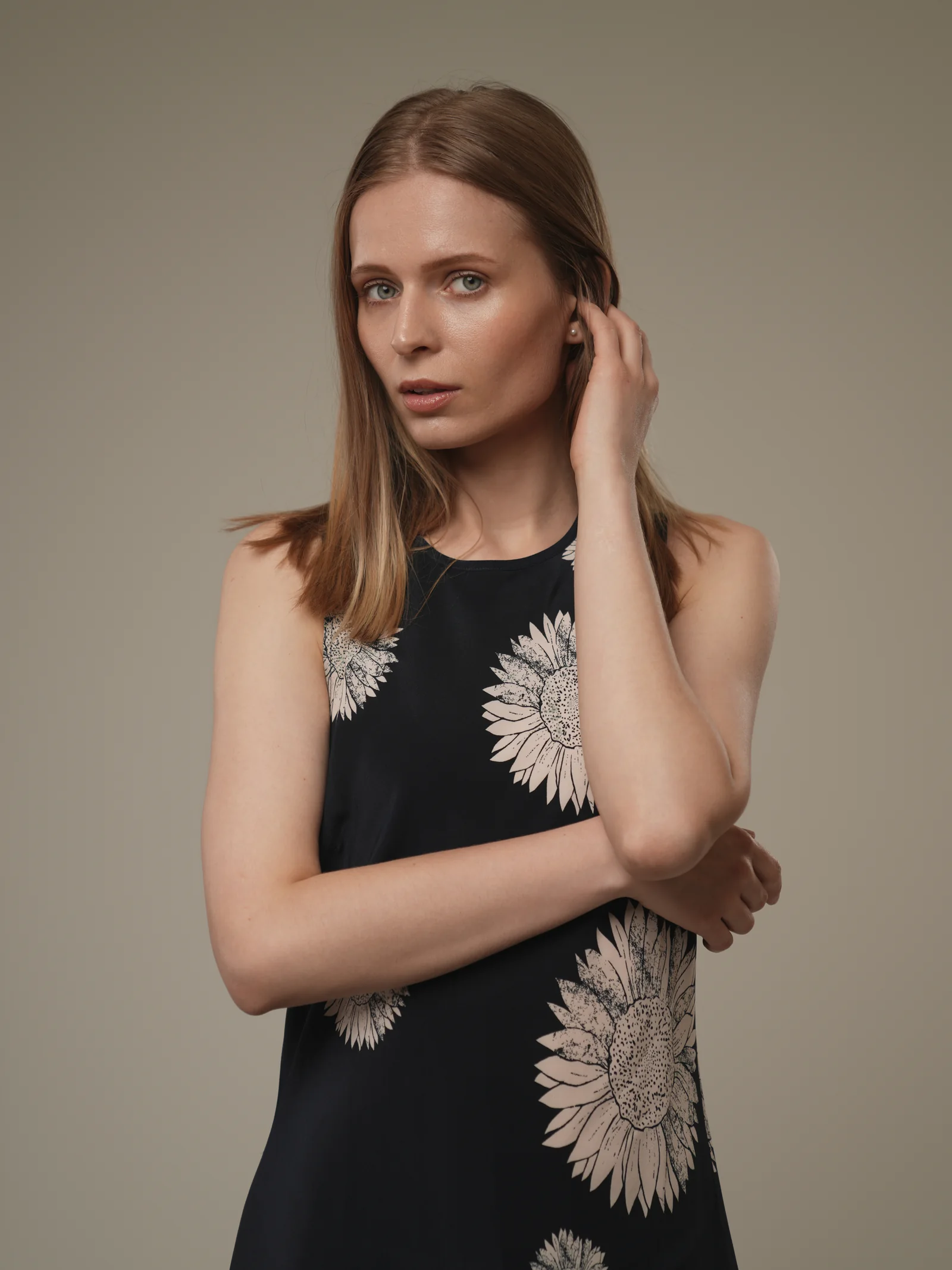 Model in navy daisy-print dress photographed in studio by Studio Letouch Kuwait