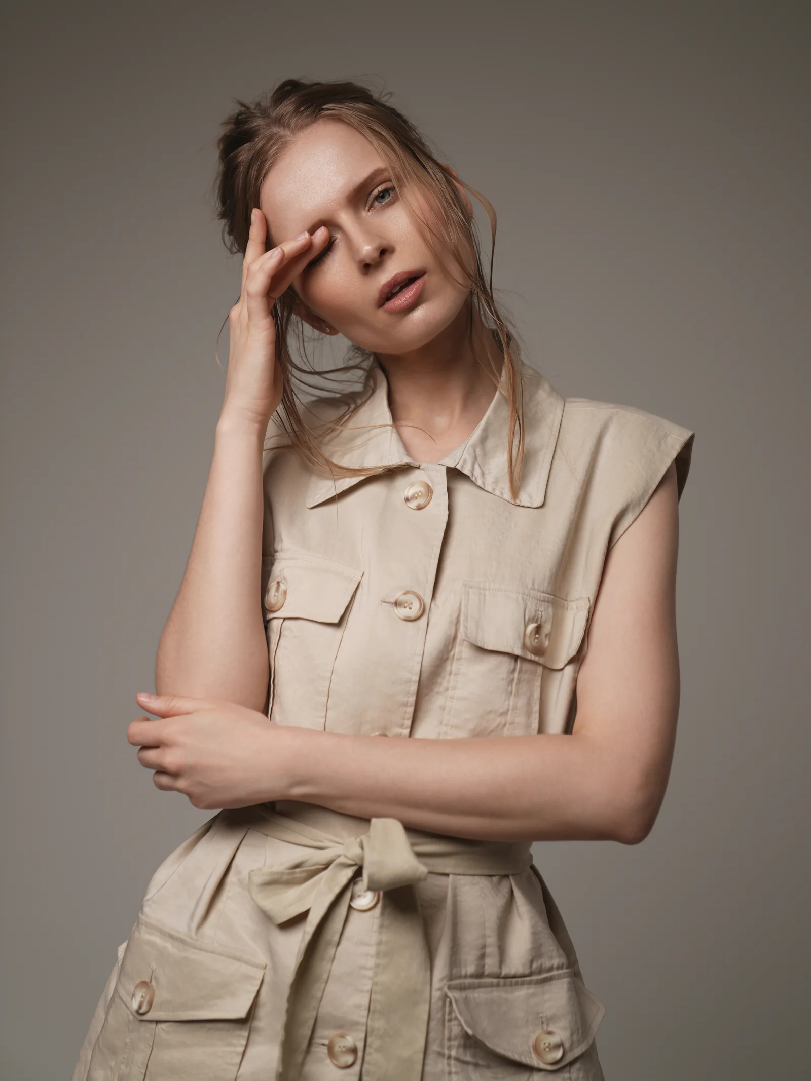 Studio portrait of model in beige linen vest, summer editorial Kuwait