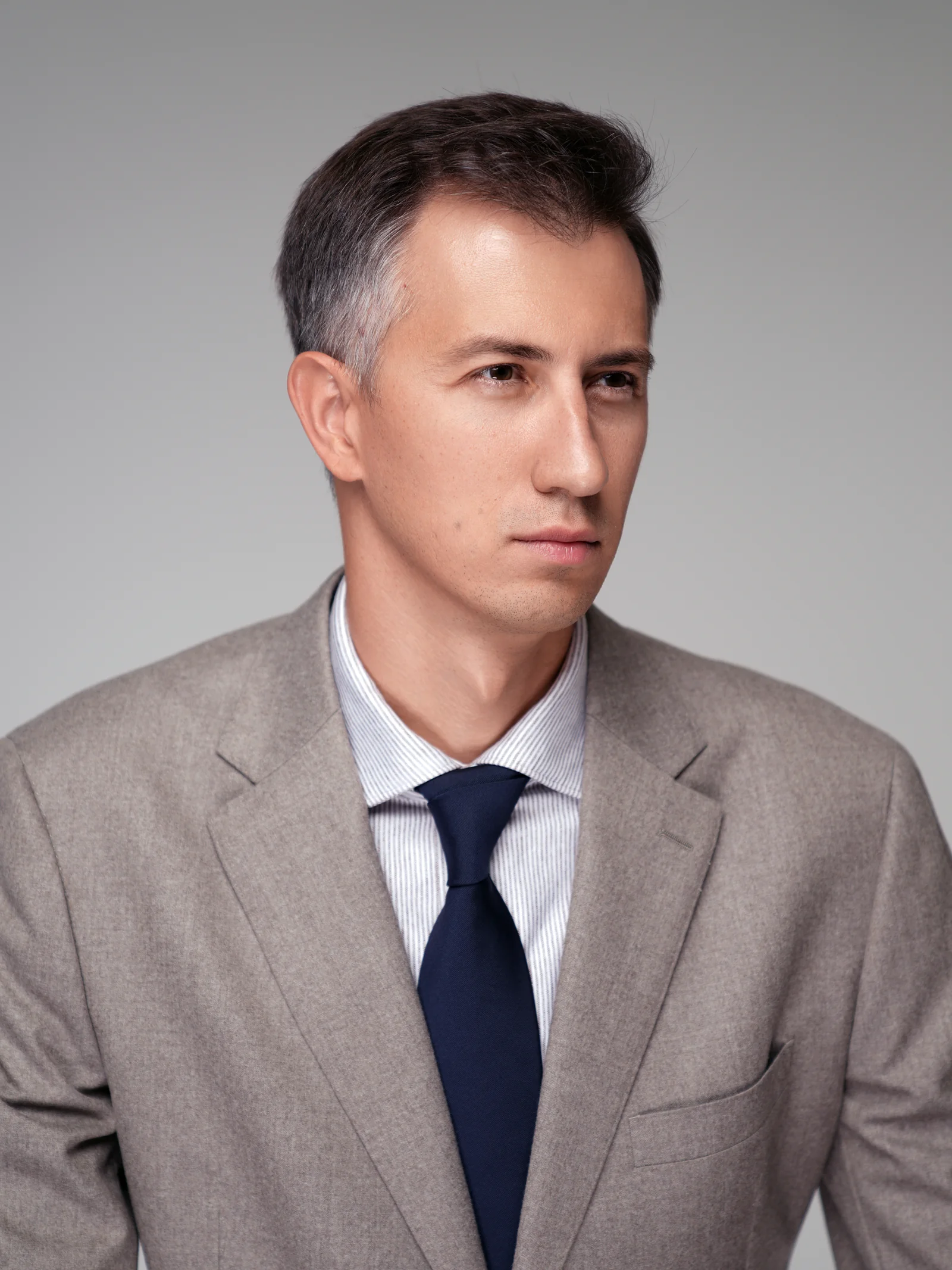 Profile portrait of executive in beige suit, corporate session Kuwait