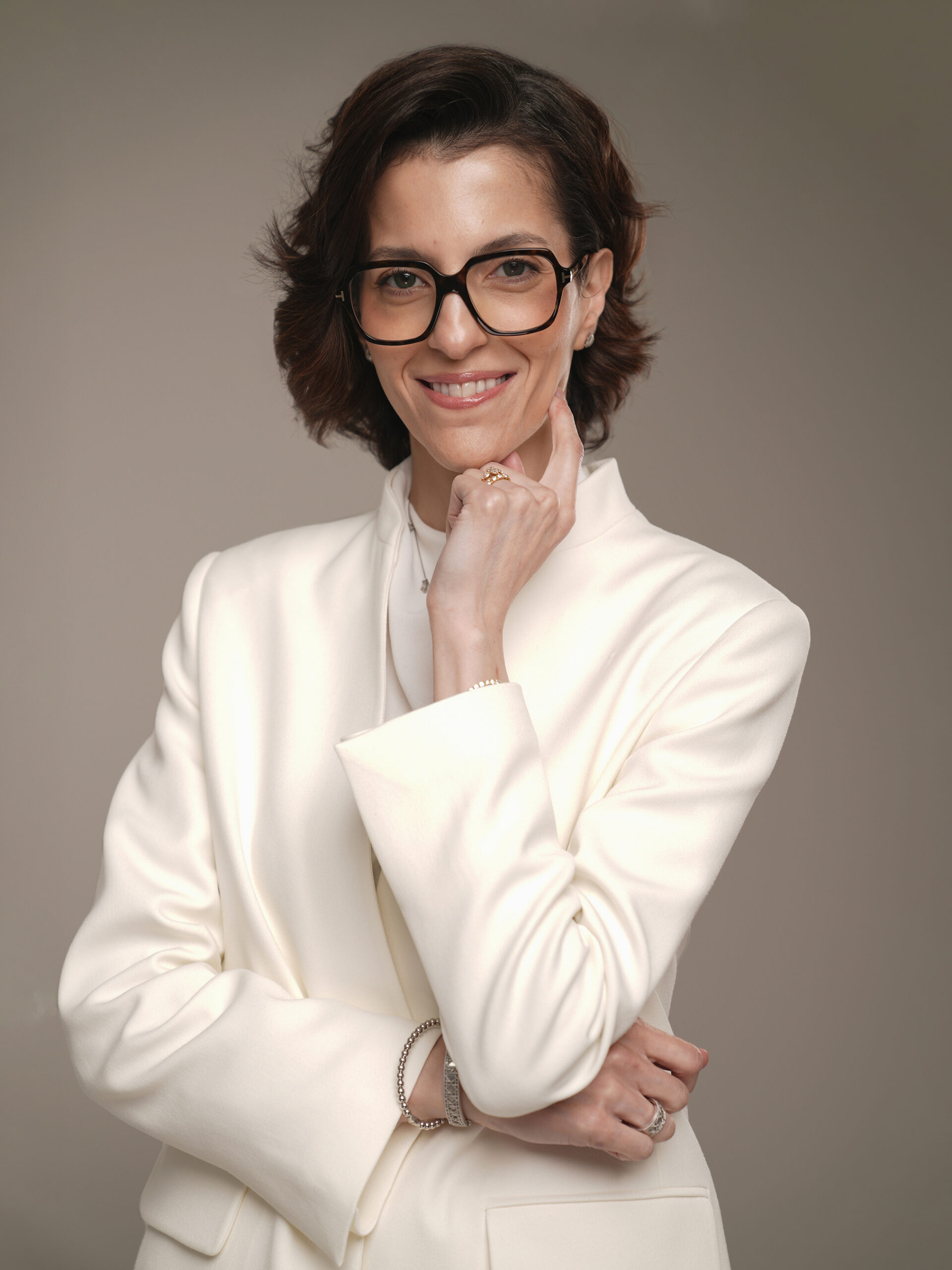 Personal branding portrait of a professional woman in an ivory suit, Studio Letouch Kuwait